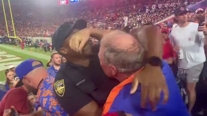 Grabbing officers face. Grabbing officers face.